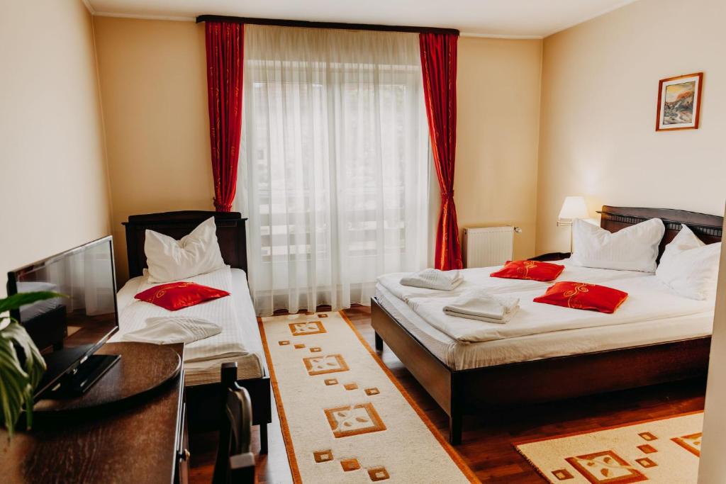 Postel nebo postele na pokoji v ubytování Páva City