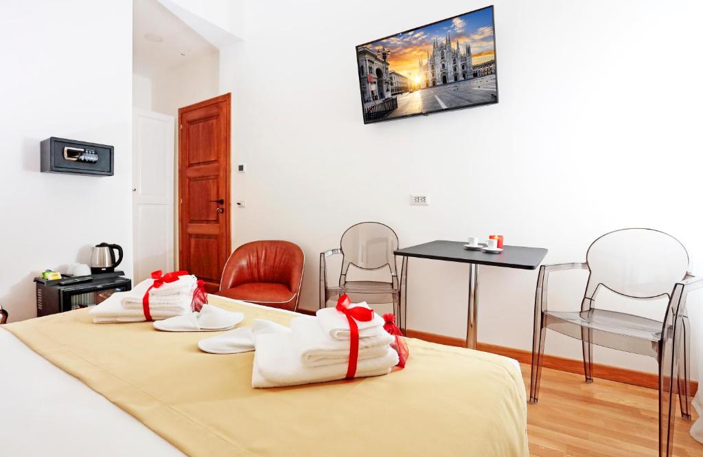 Televízia a/alebo spoločenská miestnosť v ubytovaní HeMi Suites