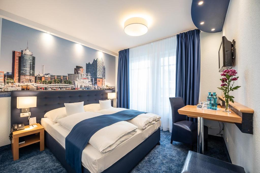 a hotel room with a bed and a view of a city at Hotel Hanseport Hamburg in Hamburg