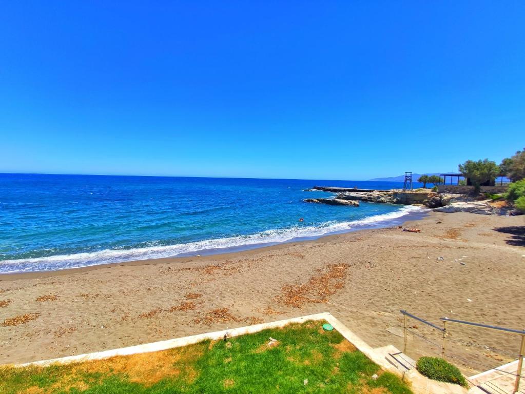 a view of a beach with the ocean at Thalia deco City & Beach Hotel in Hersonissos