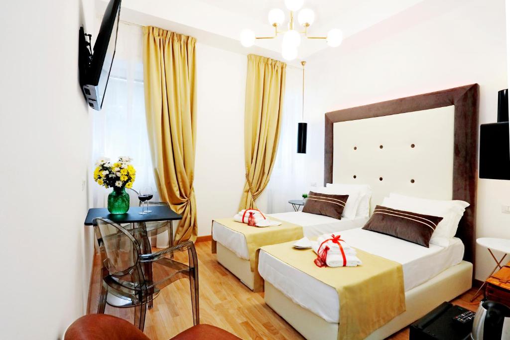 Posteľ alebo postele v izbe v ubytovaní HeMi Suites