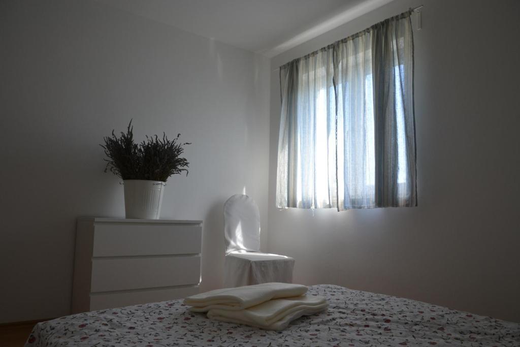 Postel nebo postele na pokoji v ubytování Apartments Roža