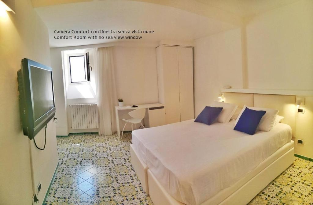 Кровать или кровати в номере Hotel Villa Felice Relais