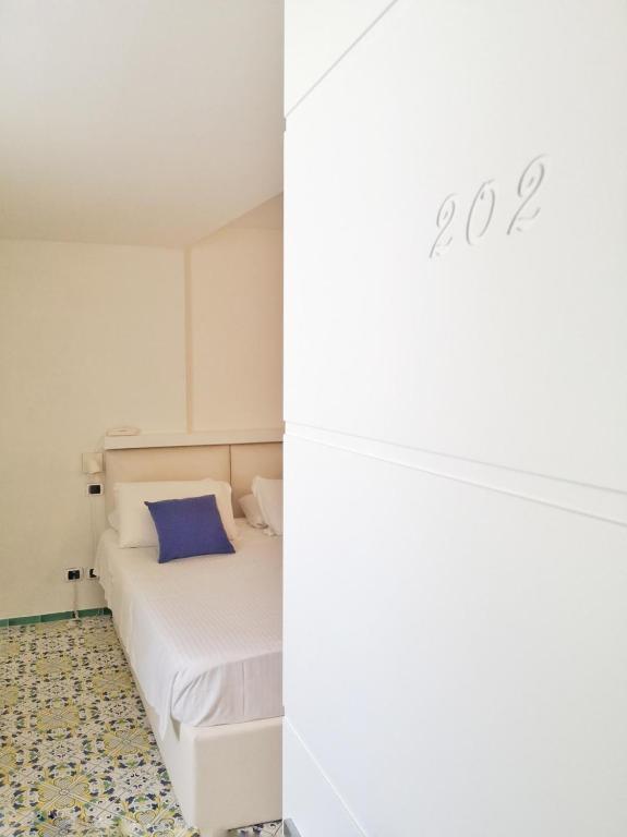 Кровать или кровати в номере Hotel Villa Felice Relais