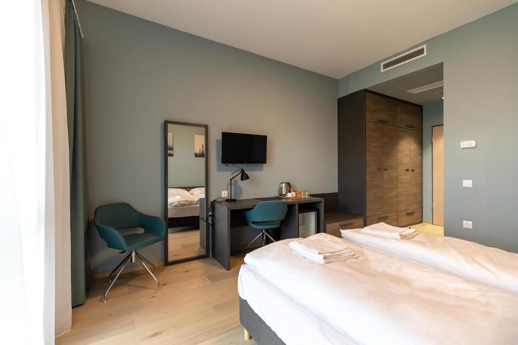 Postel nebo postele na pokoji v ubytování A22 Hotel Gyál