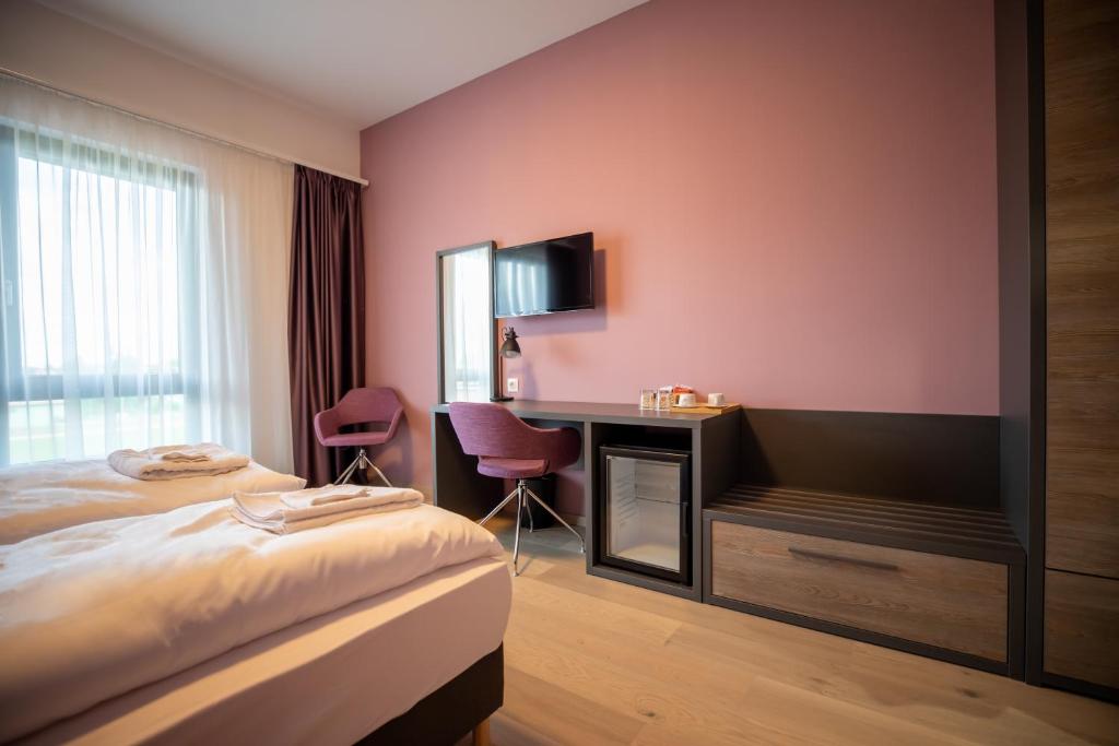 Postel nebo postele na pokoji v ubytování A22 Hotel Gyál