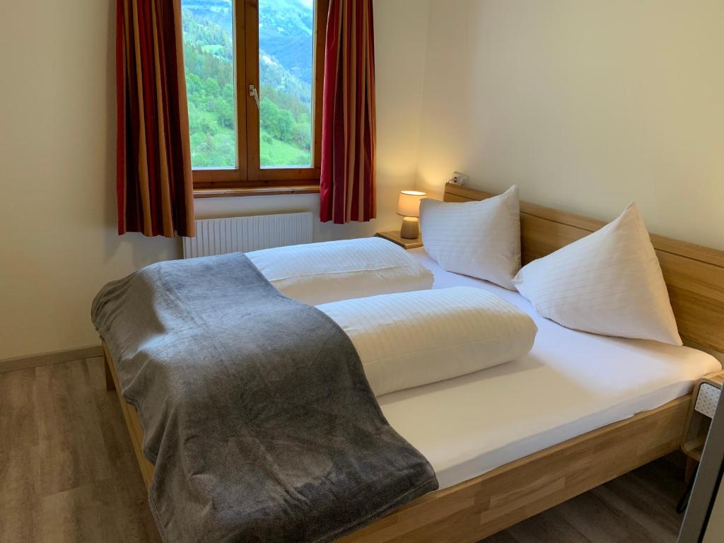 Postel nebo postele na pokoji v ubytování Ferienhaus am Burgsee
