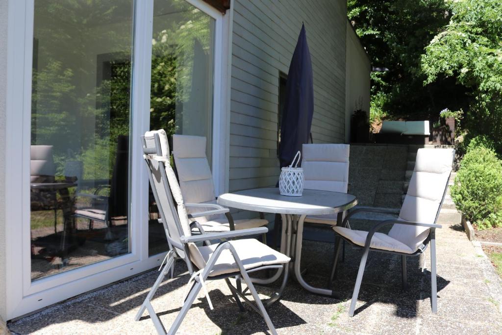 a table and two chairs on a patio at Haus Berger in Fuschl am See