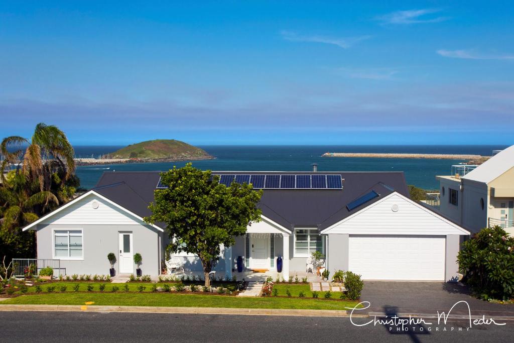 a house with a view of the ocean at Jetty Splendour Guest Bedroom with Bathroom en-suite B'nB in Coffs Harbour