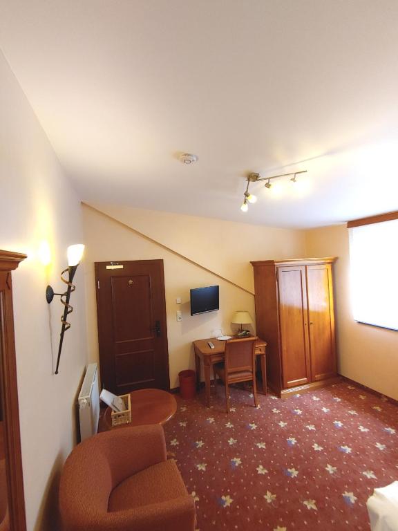 Posezení v ubytování AKZENT Hotel Berg's Alte Bauernschänke- Wellness und Wein