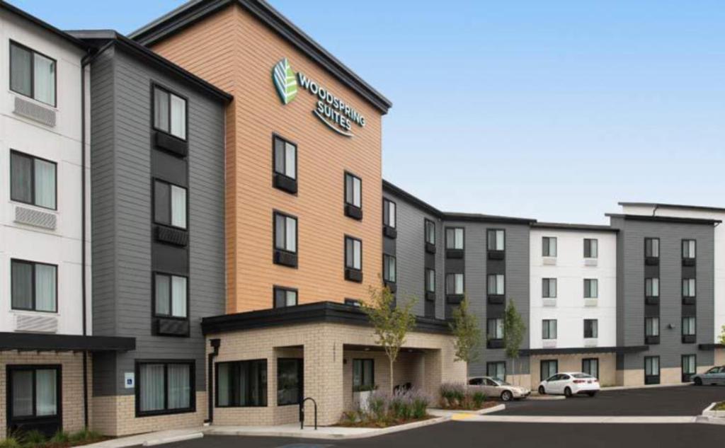 a rendering of the front of a hotel at WoodSpring Suites Seattle Tukwila in Tukwila
