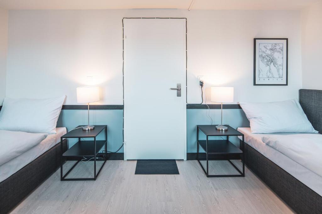Ein Bett oder Betten in einem Zimmer der Unterkunft Pop Up Hotel Krone Zürich