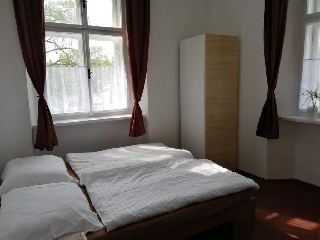 Postel nebo postele na pokoji v ubytování Penzion U Šlechtičen