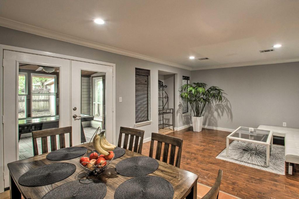 a dining room with a table with fruit on it at 2-Story Pensacola Home with Game Room and Private Yard in Pensacola