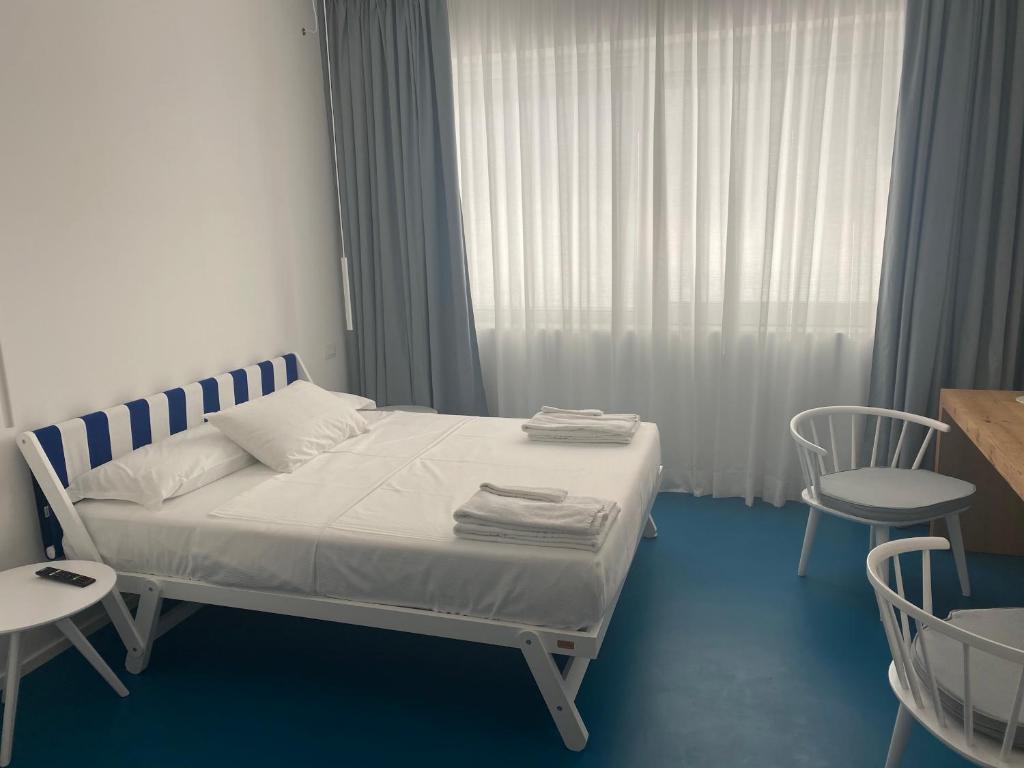 Postel nebo postele na pokoji v ubytování Near Ortigia