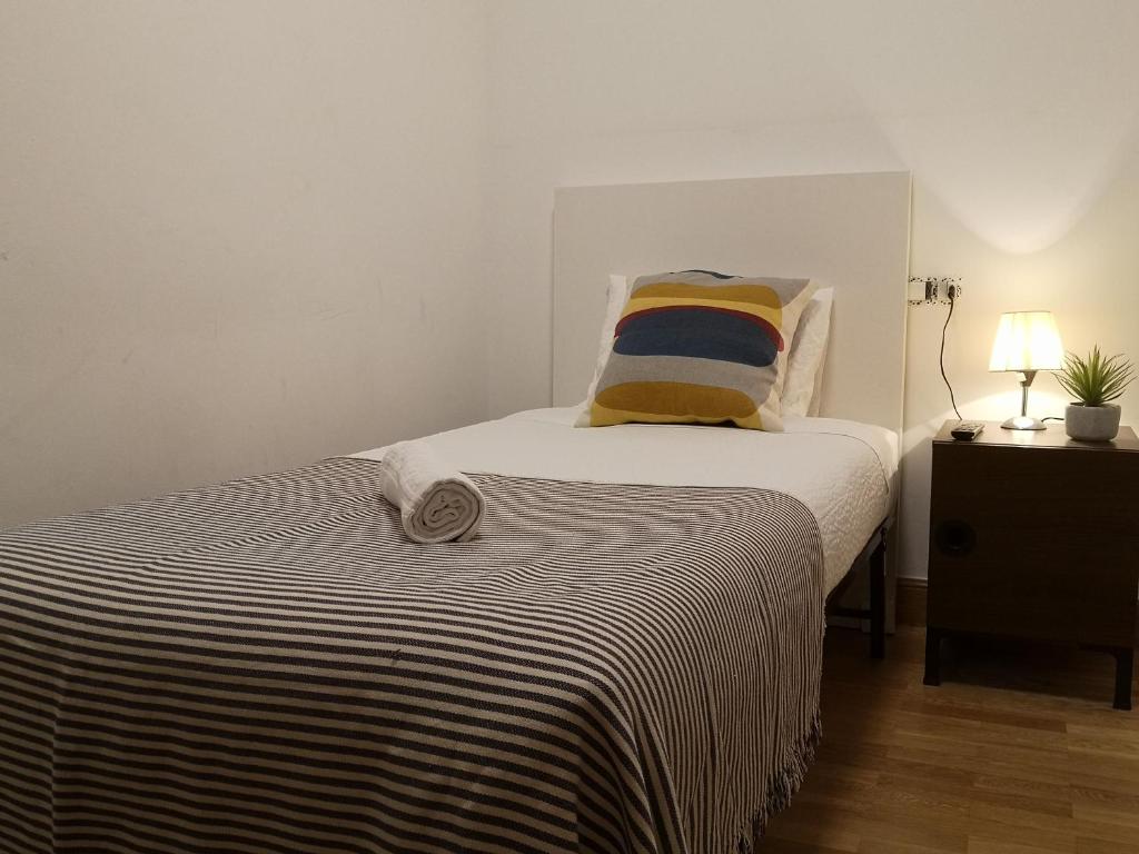 Posteľ alebo postele v izbe v ubytovaní Apartamento Amplio y Central a pie de Playa la Concha
