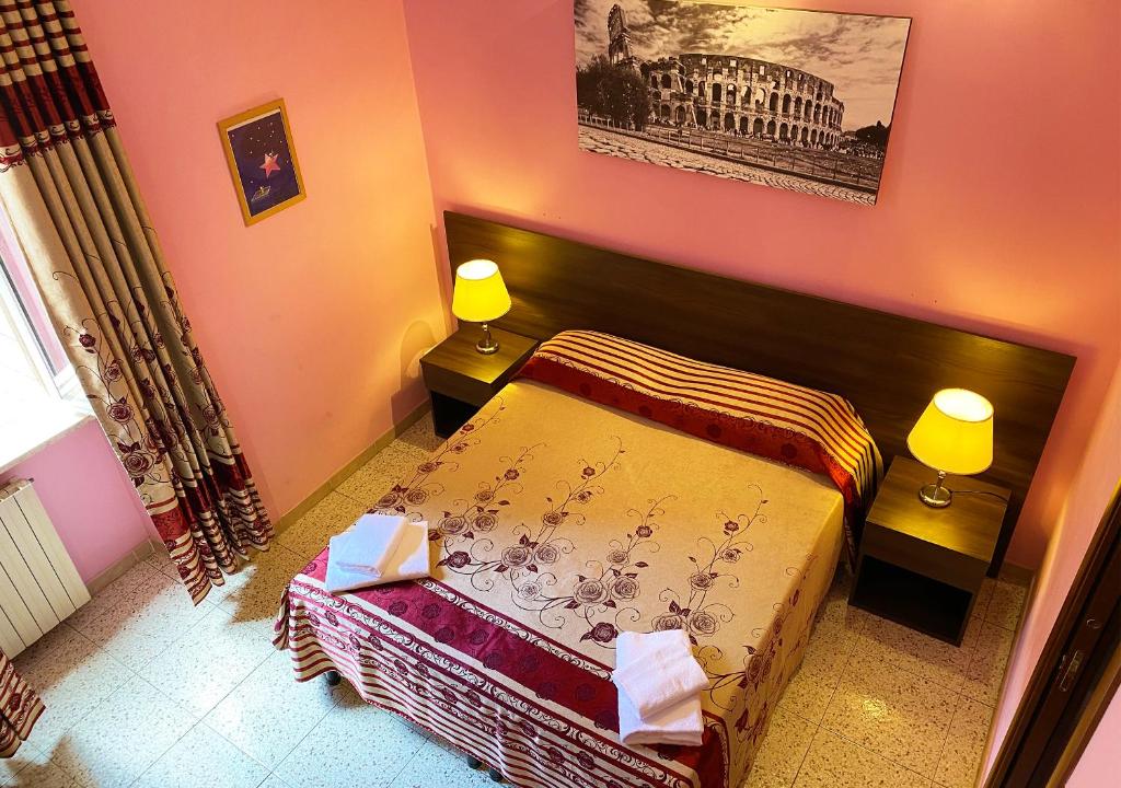 Postel nebo postele na pokoji v ubytování Sweet Dream Roma Termini
