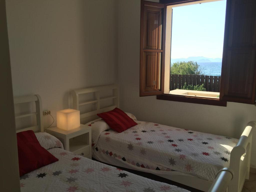 Postel nebo postele na pokoji v ubytování Villa Catalá