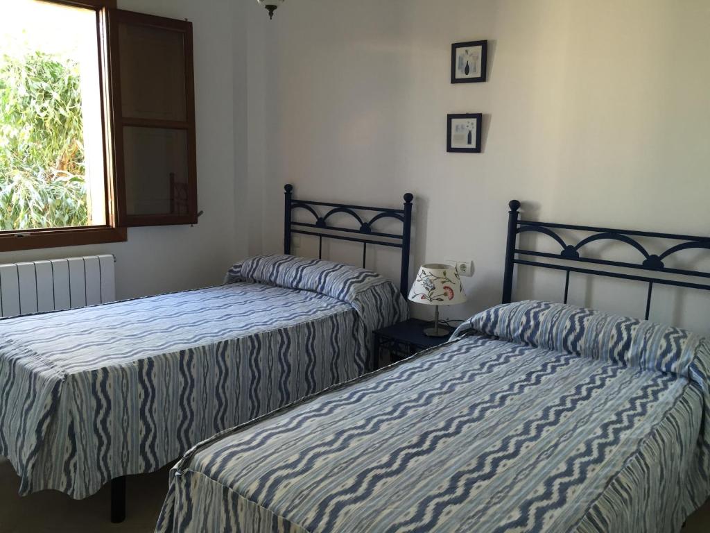 Postel nebo postele na pokoji v ubytování Villa Catalá