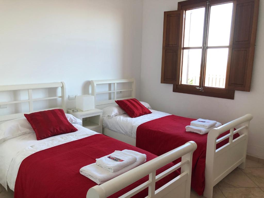 Postel nebo postele na pokoji v ubytování Villa Catalá