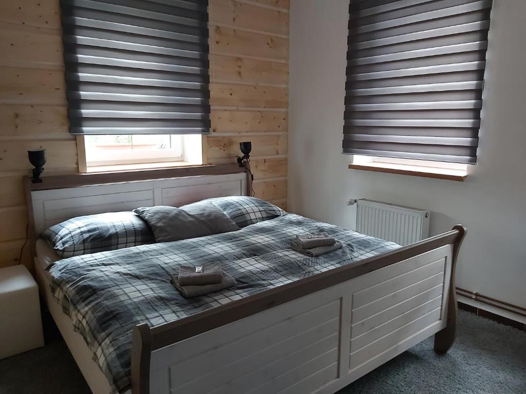 Postel nebo postele na pokoji v ubytování Svatý Jakub