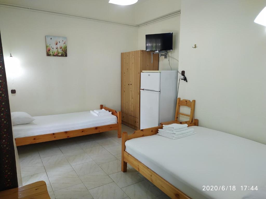 Postel nebo postele na pokoji v ubytování Akamatis Giorgos