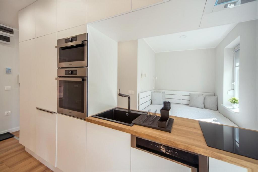 Kuchyň nebo kuchyňský kout v ubytování RÉS Apartman