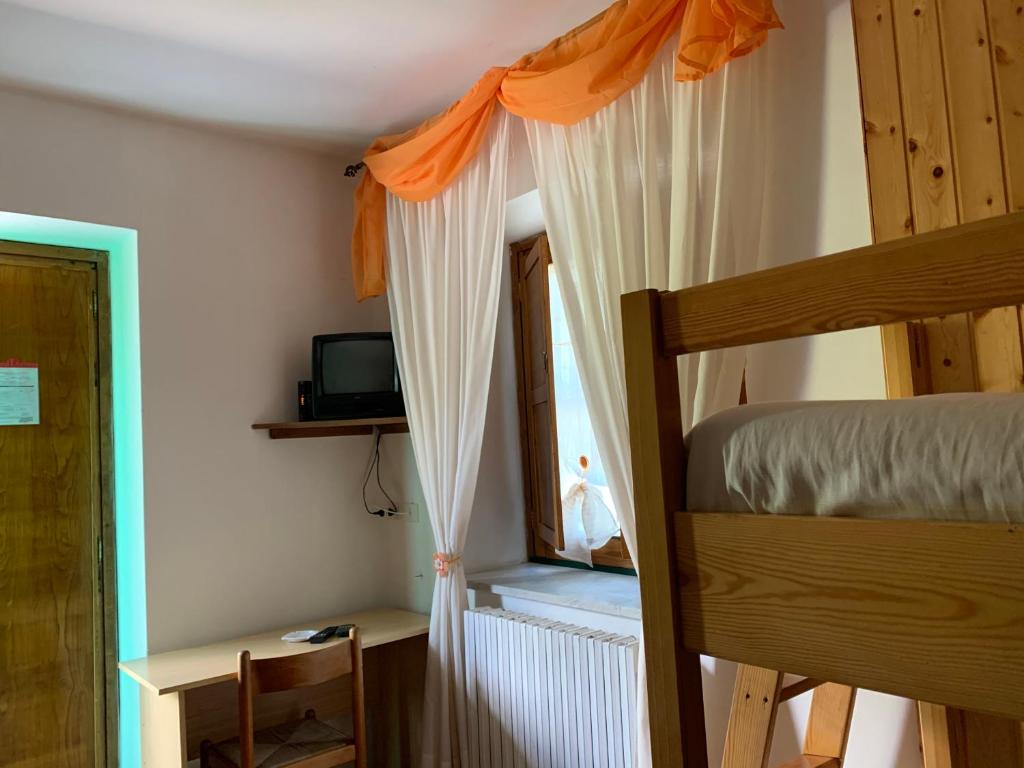 Postel nebo postele na pokoji v ubytování Residence il Varco del Pollino