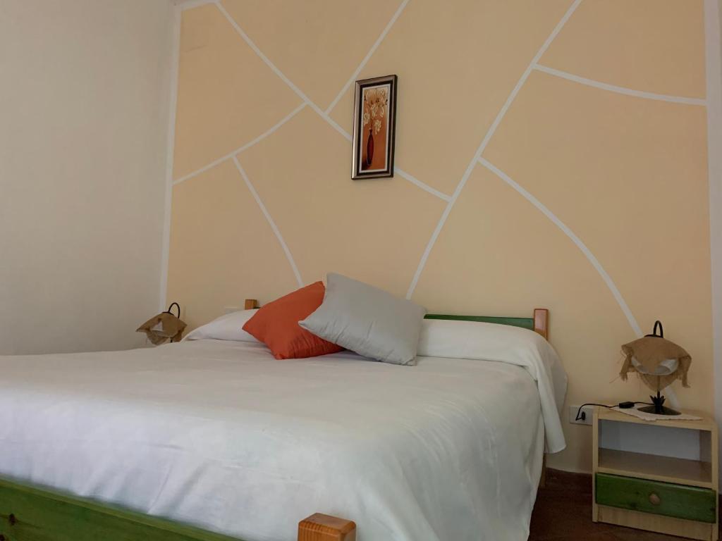 Postel nebo postele na pokoji v ubytování Residence il Varco del Pollino