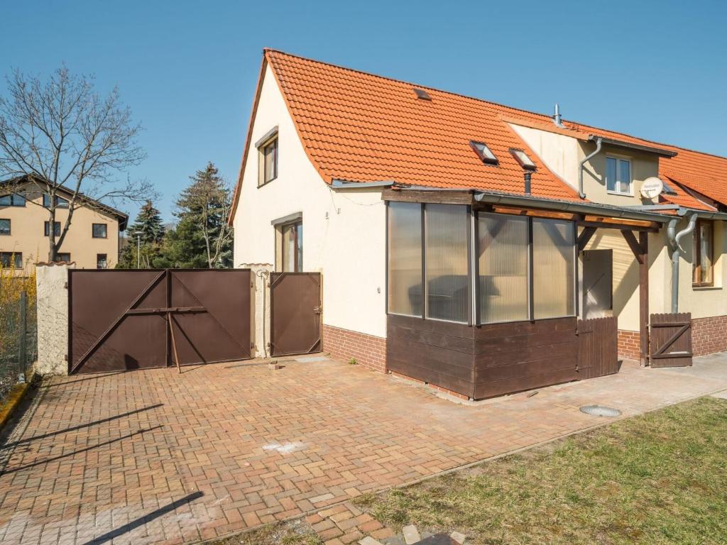 a detached house with a large glass extension at Alluring Holiday Home in Meisdorf with Garden in Meisdorf