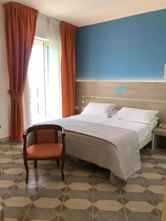 Postel nebo postele na pokoji v ubytování Hotel Capri 3 Stelle SUPERIOR
