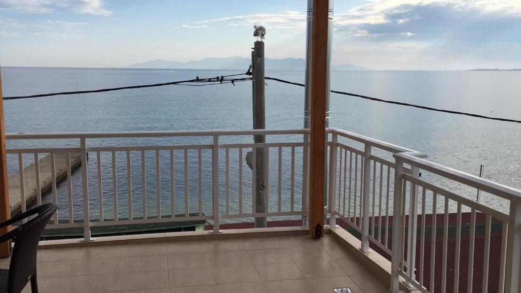 a balcony with a view of the water at Emy Studios in Fanari
