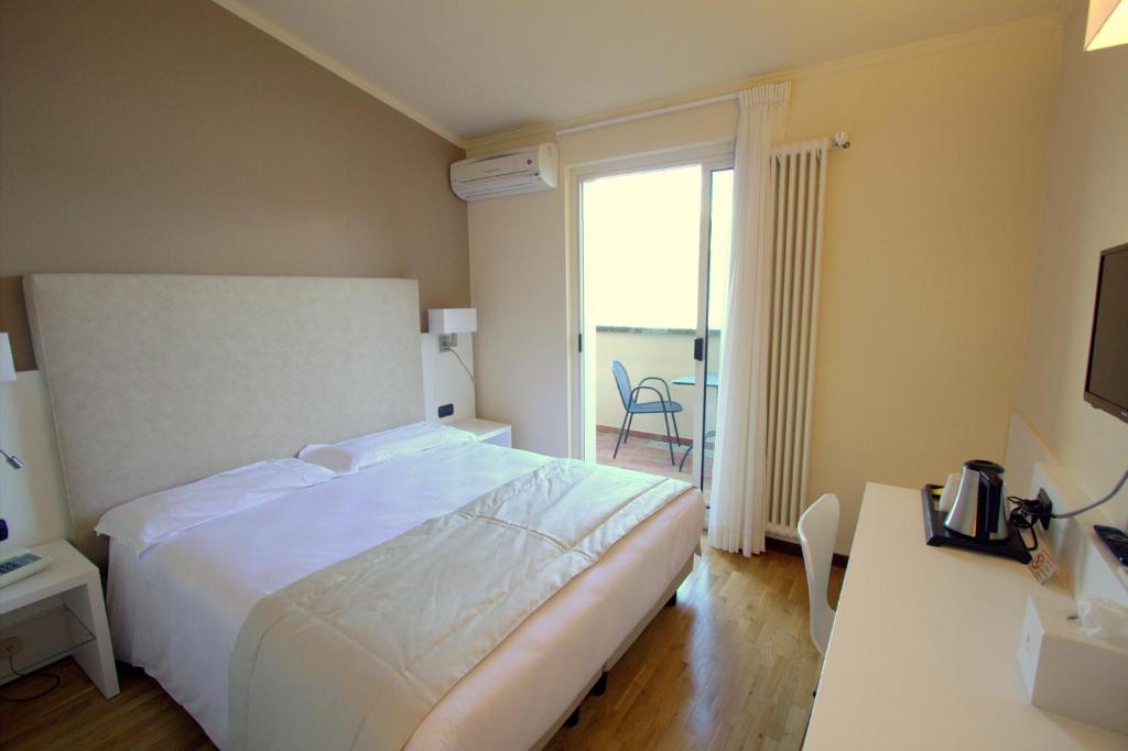 Postel nebo postele na pokoji v ubytování Hotel Bellavista