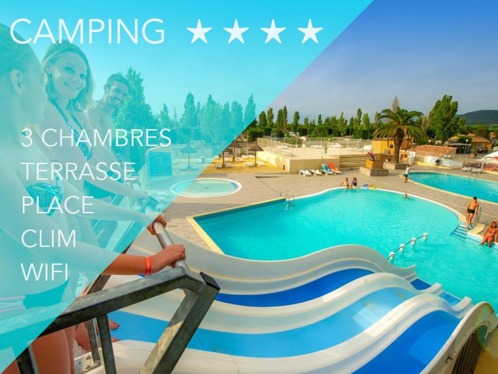 a picture of a swimming pool with a slide at L europe in Vic-la-Gardiole