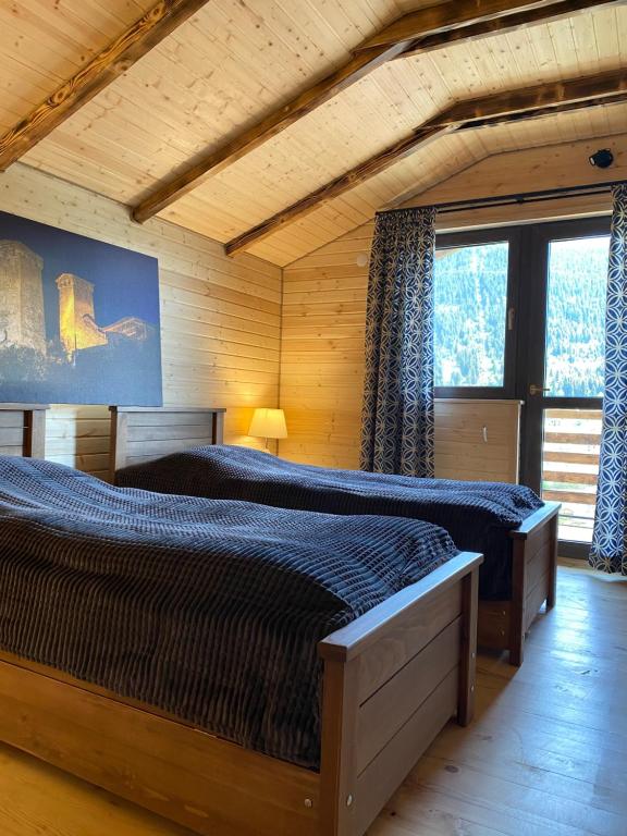 Postel nebo postele na pokoji v ubytování Villa Dabderr Mestia