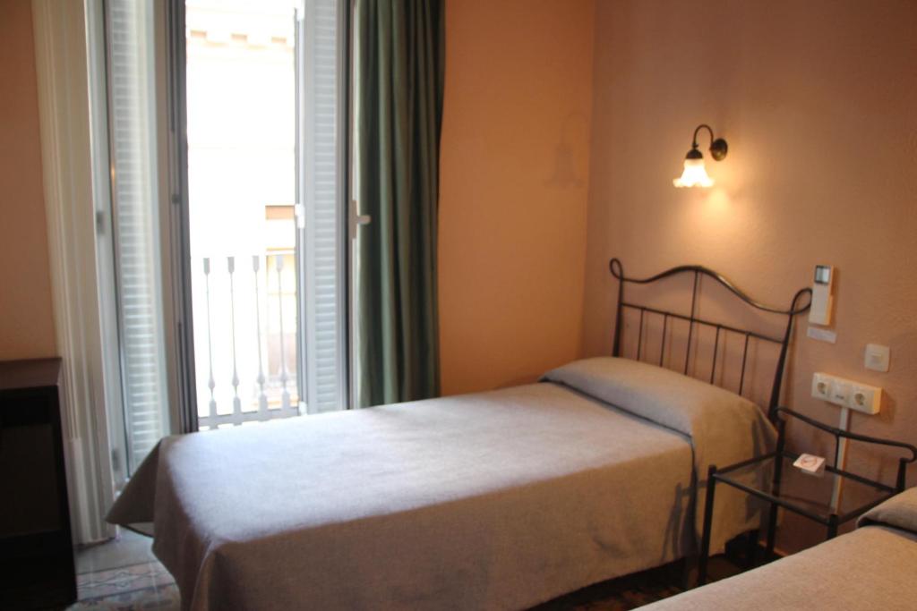 Posteľ alebo postele v izbe v ubytovaní Hotel Peninsular