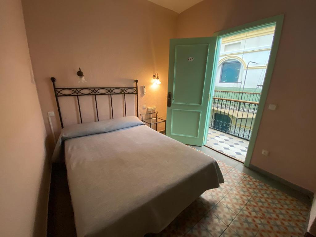 Posteľ alebo postele v izbe v ubytovaní Hotel Peninsular