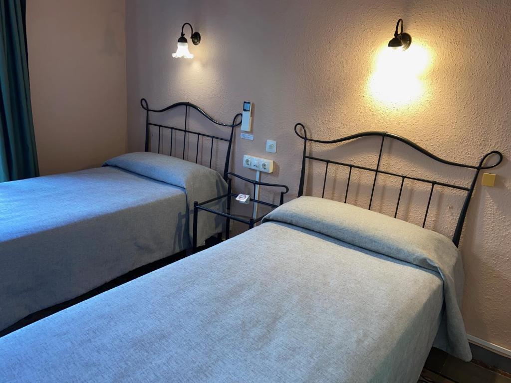 Posteľ alebo postele v izbe v ubytovaní Hotel Peninsular