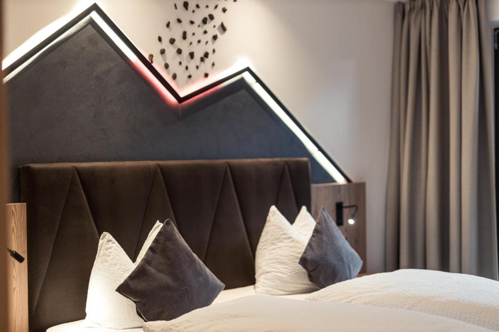 Postel nebo postele na pokoji v ubytování Hotel Berghang