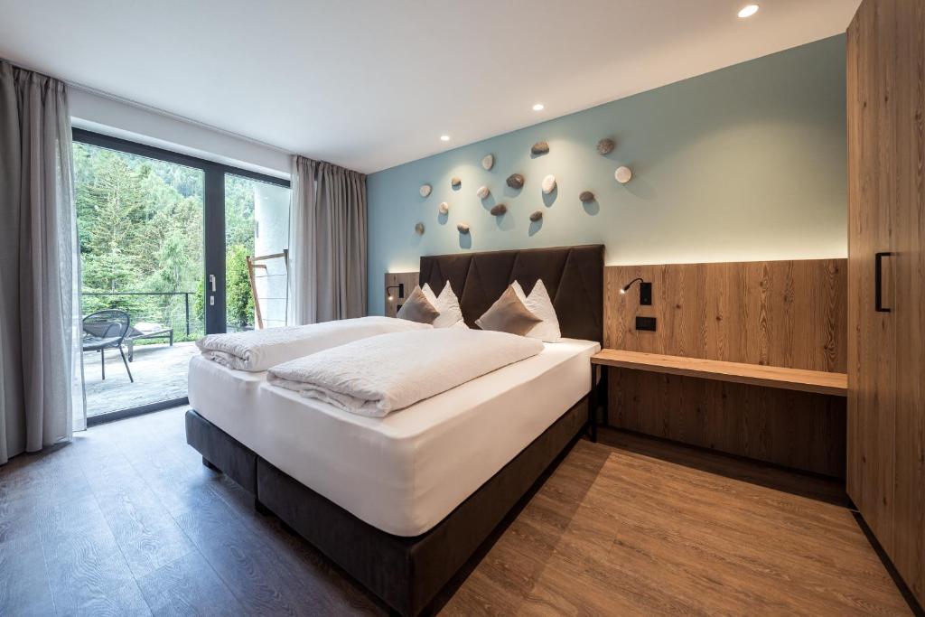 Postel nebo postele na pokoji v ubytování Hotel Berghang