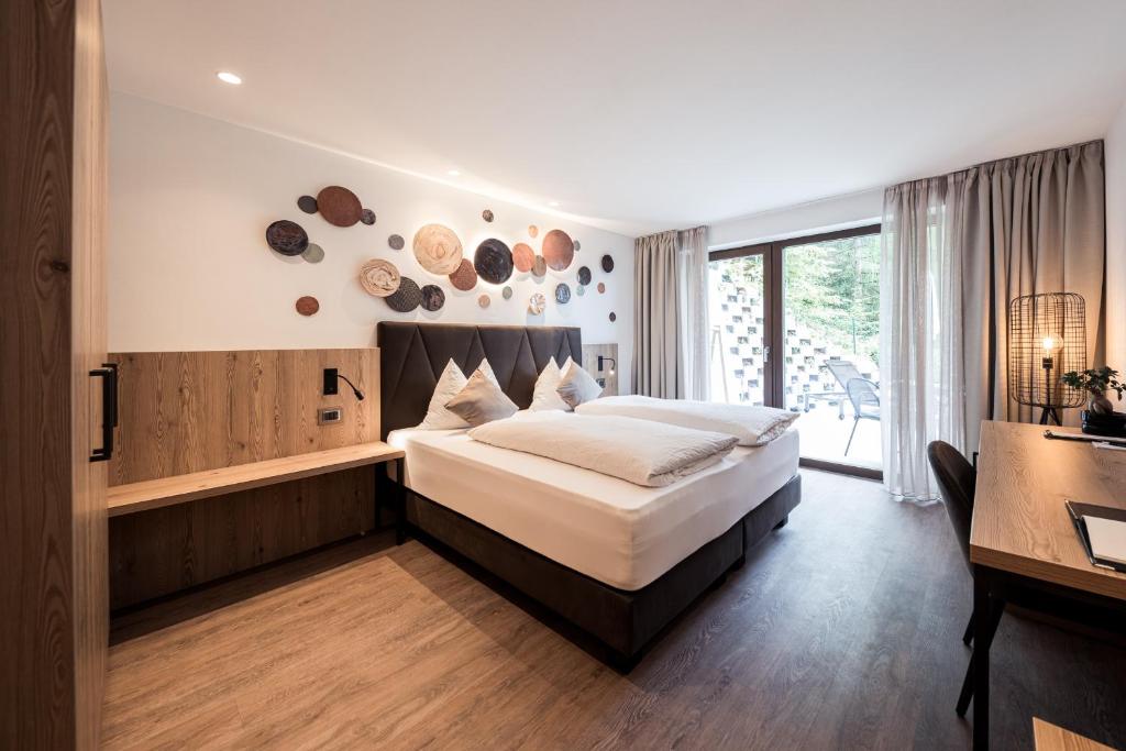 Postel nebo postele na pokoji v ubytování Hotel Berghang