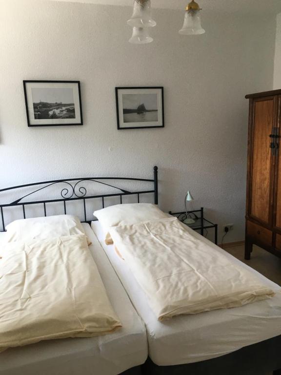 Postel nebo postele na pokoji v ubytování Hugos Haus & Berthas Haus