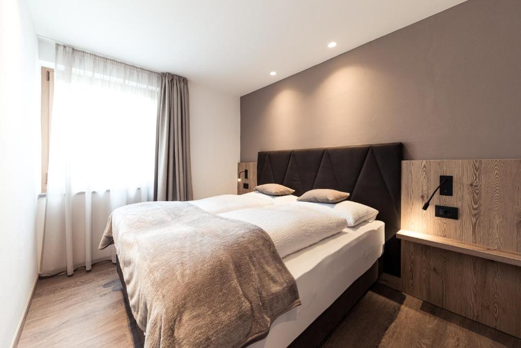 Postel nebo postele na pokoji v ubytování Hotel Berghang