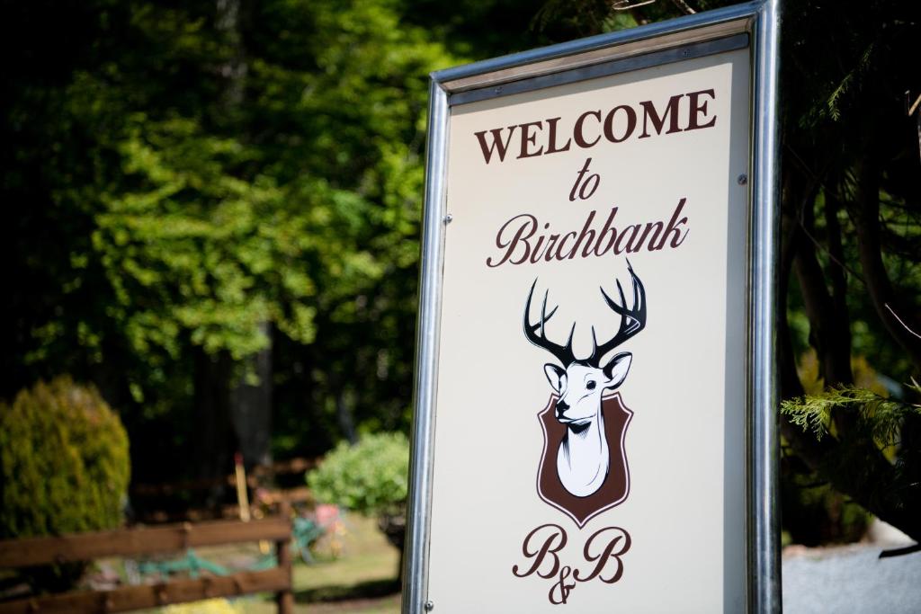 a sign for a welcome to bird exhibit at Birchbank in Roybridge