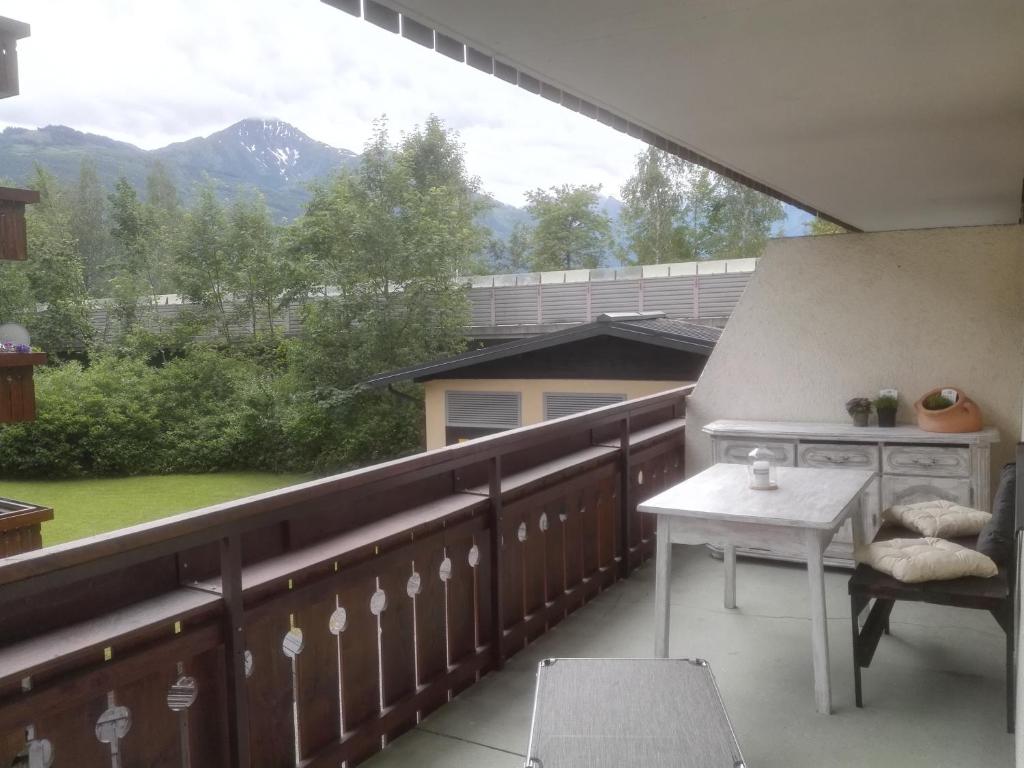 a balcony with a table and a view of a mountain at Apartment Angelika in Zell am See