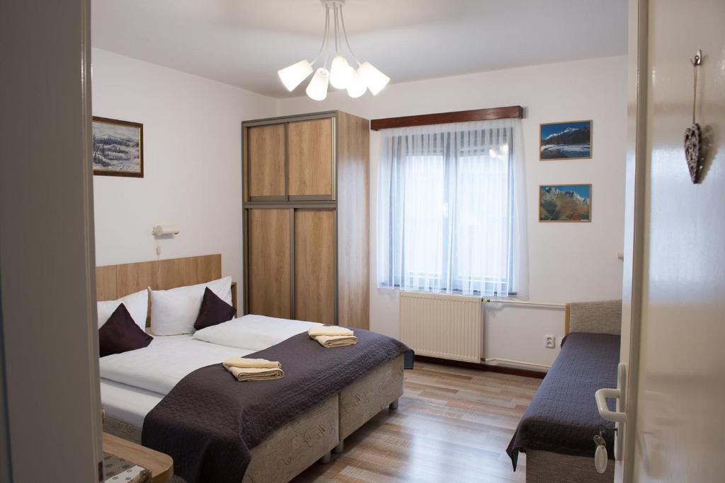 Posteľ alebo postele v izbe v ubytovaní Vila Malá Marta