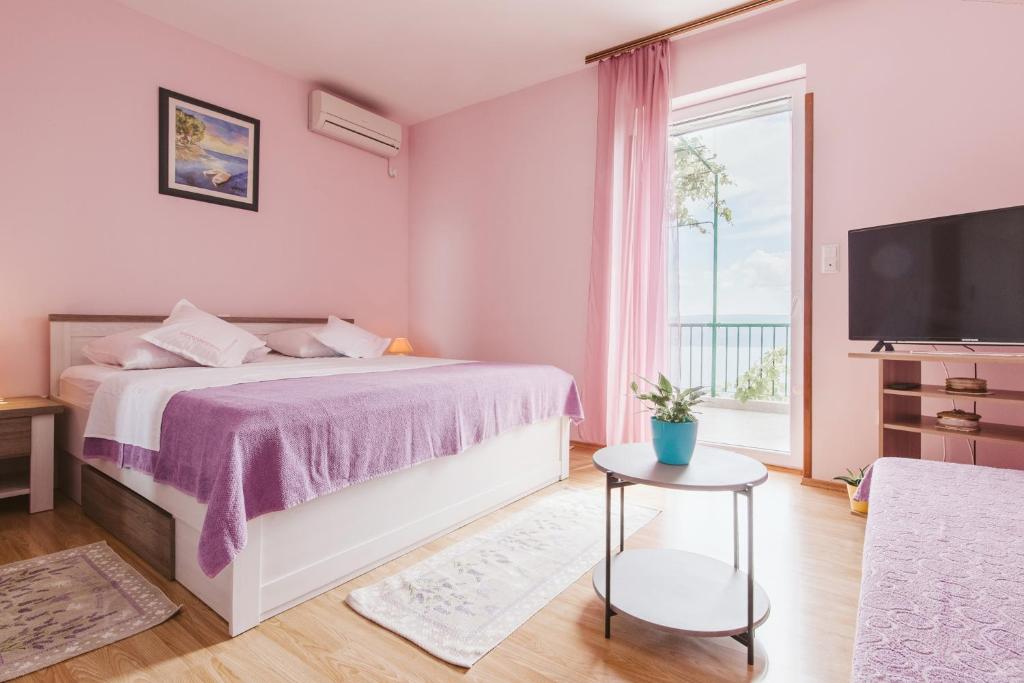 Postel nebo postele na pokoji v ubytování Apartment Kuzmanić