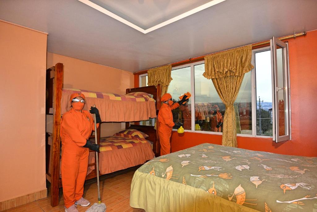 Postel nebo postele na pokoji v ubytování Hotel Gran Quitumbe