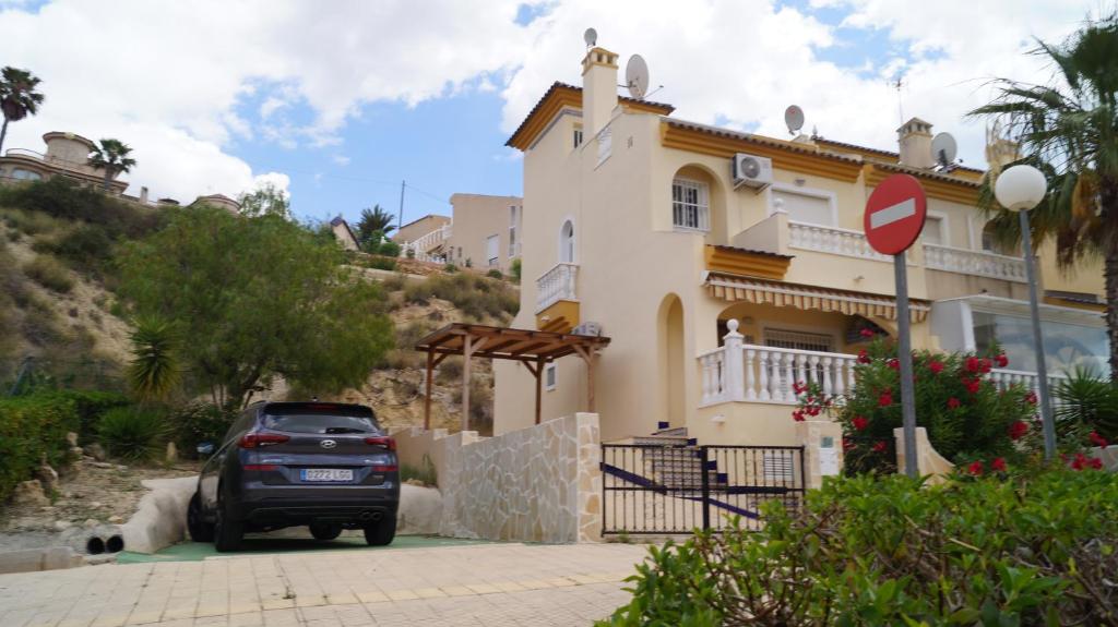 a car parked in front of a house at Casa Yvonne in Rojales
