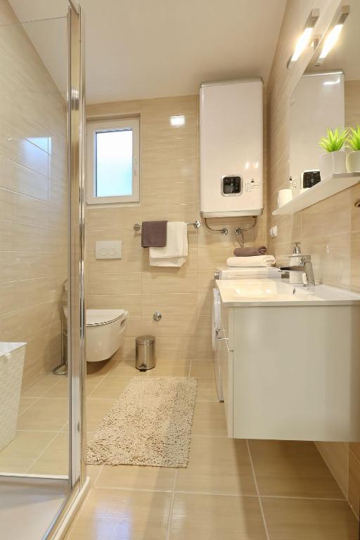 Koupelna v ubytování Apartments Lisac